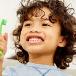 kid-with-toothbrush